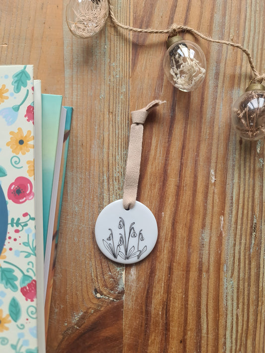 Médaillon rond en porcelaine - décor perce-neige peint à la main