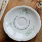 Coupelle ronde fleurs bleues chinée en porcelaine - décor phrase mantra