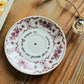 Coupelle ronde fleurs prunes chinée en porcelaine - décor Phrase mantra